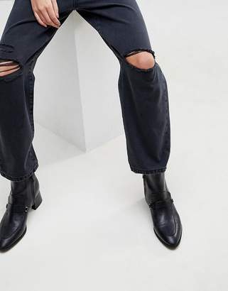 ASOS Design DESIGN barrel leg boyfriend jeans in washed black with knee rips