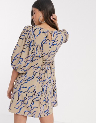 Vero Moda skater dress with puff sleeve and lace back detail in nude abstract print