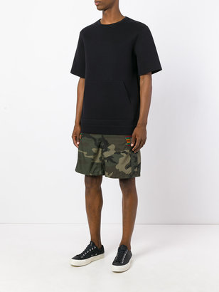 Facetasm camouflage print shorts