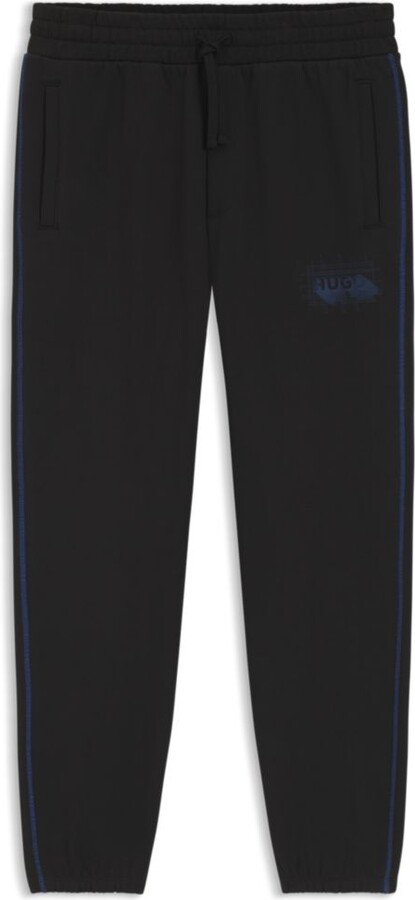 HUGO BOSS Logo-artwork tracksuit bottoms in cotton terry