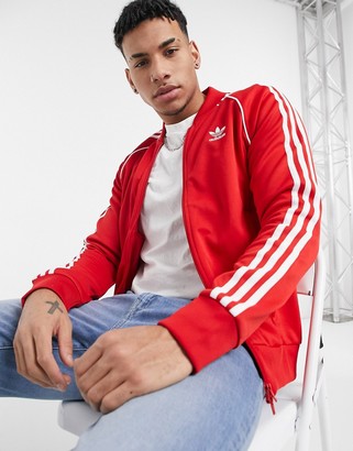 adidas track jacket in red - ShopStyle