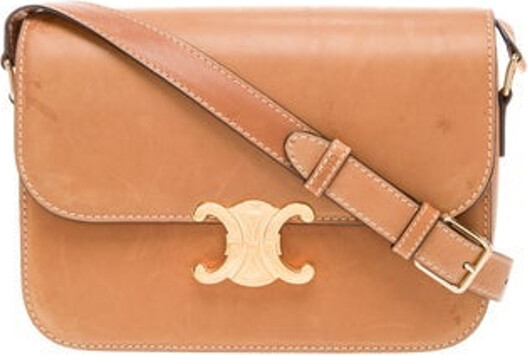 Celine Crossbody Bag From the 2020 Collection by Hedi Slimane Brown Calfskin Triomphe Gold-Tone Hardware Single Adjustable Shoulder Strap Leather Lining & Dual Interior Pockets Push-Lock Closure at Front Unfortunately, due to restrictions, this item may not be eligible for shipping in all areas.