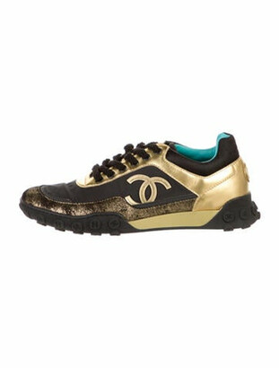 chanel black sneakers with gold cc