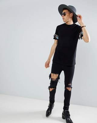 ASOS DESIGN festival relaxed longline t-shirt with geo-tribal coin sleeve taping