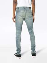 Thumbnail for your product : Amiri art patch printed jeans