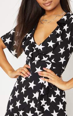PrettyLittleThing Black Star Print Frill Wrap Over Tea Dress