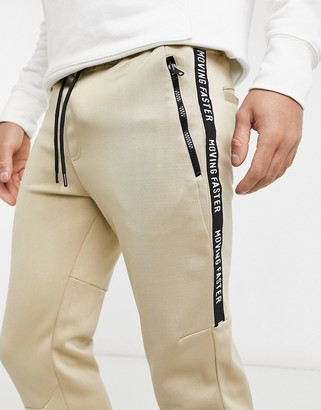 Bershka sweatpants with taping in beige scuba - ShopStyle Activewear Pants