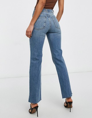 ASOS Tall ASOS DESIGN Tall high rise stretch 'effortless' crop kick flare  jeans in midwash with thigh rip - ShopStyle