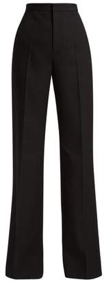 Givenchy High-rise Pleated Flared Wool Trousers - Womens - Black