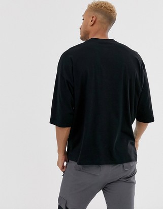 ASOS DESIGN organic cotton oversized t-shirt with animal colour block block and contrast pocket