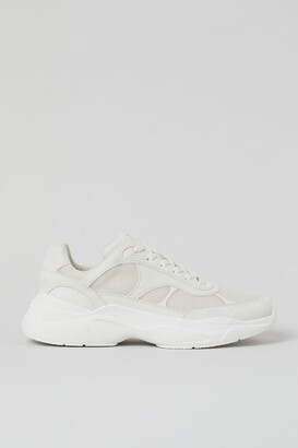 white and beige chunky trainers