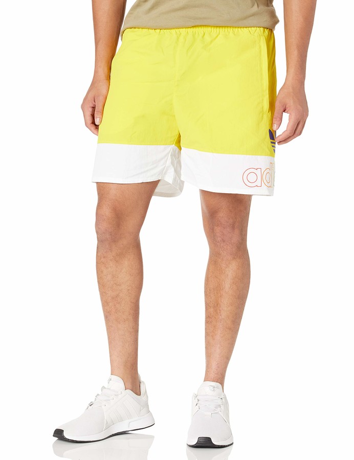 yellow and white adidas shorts