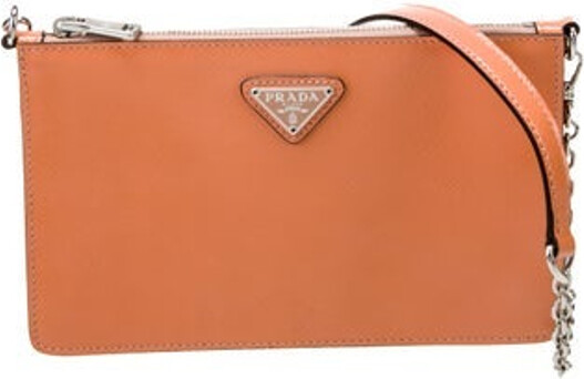 Prada Crossbody Bag Neutrals Saffiano Vernice Leather Enameled Metal Triangle Silver-Tone Hardware Jacquard Lining Zip Closure at Top Includes Dust Bag