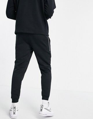 Nike Tribute knit joggers in black - ShopStyle Trousers