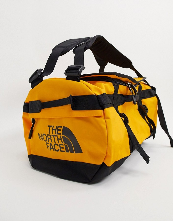 The North Face Base Camp small duffel bag 50L in yellow - ShopStyle  Activewear