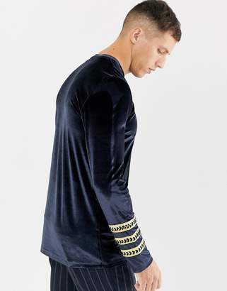 ASOS Design DESIGN longline long sleeve t-shirt with sleeve taping in velour in navy