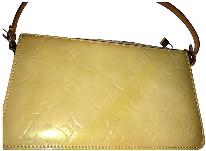 yellow patent clutch bag