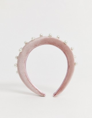 ASOS DESIGN padded headband in pink velvet with pearl embellishment