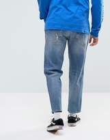 Thumbnail for your product : ASOS Design Skater Jeans In Mid Wash Blue With Abrasions