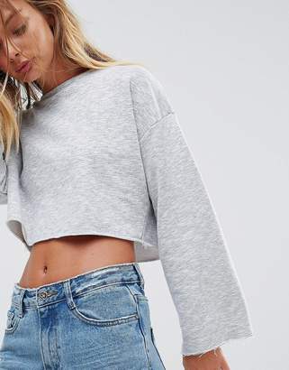NATIVE YOUTH Wide Sleeve Crop Top With Raw Edge