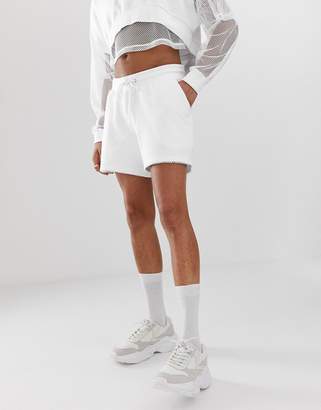 ASOS DESIGN two-piece jersey relaxed shorts with mesh overlay in white