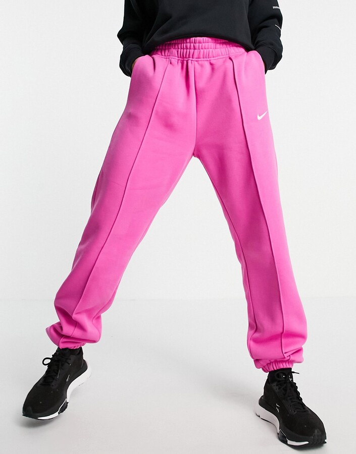 Nike mini swoosh oversized sweatpants in fuchsia pink - ShopStyle  Activewear Pants
