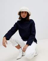 Thumbnail for your product : WÅVEN Eleni destroyed denim funnel neck top