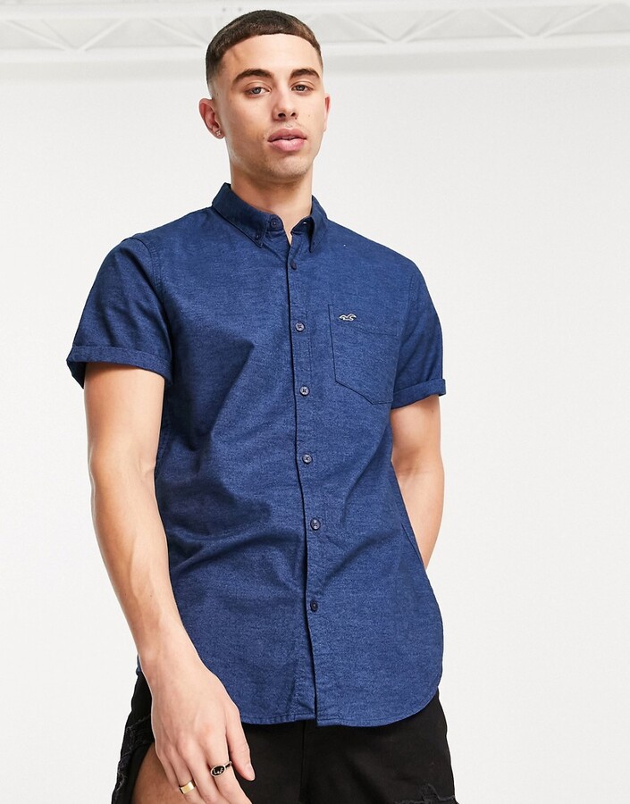Hollister icon logo short sleeve slim fit shirt in navy - ShopStyle
