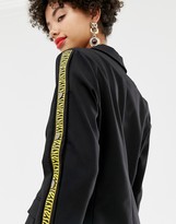 Thumbnail for your product : NA-KD popper detail blazer in black with tiger stripe