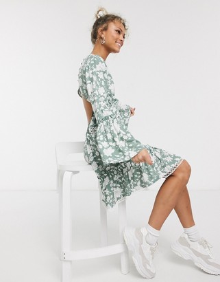 ASOS DESIGN fluted sleeve open back skater mini dress with lace inserts in floral print