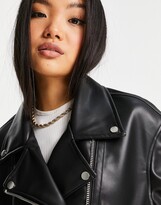 Thumbnail for your product : ASOS DESIGN Petite longline oversized faux leather biker jacket in black