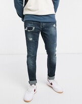 Thumbnail for your product : Topman organic cotton blend skinny jeans with repair patches in mid blue