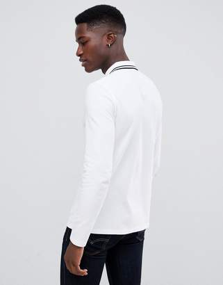 ASOS DESIGN long sleeve pique polo shirt with tipping in white