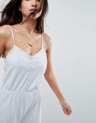 ASOS Design Cami Jersey Jumpsuit With Lace Trim And Button Front