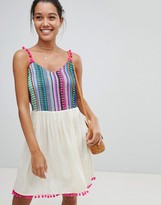 rosella white long dress with multicolor pom pom