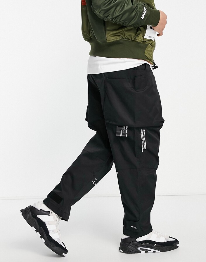 AAPE BY A BATHING APE® AAPE by A Bathing Ape super loose fit cargo pants in  black - ShopStyle Trousers