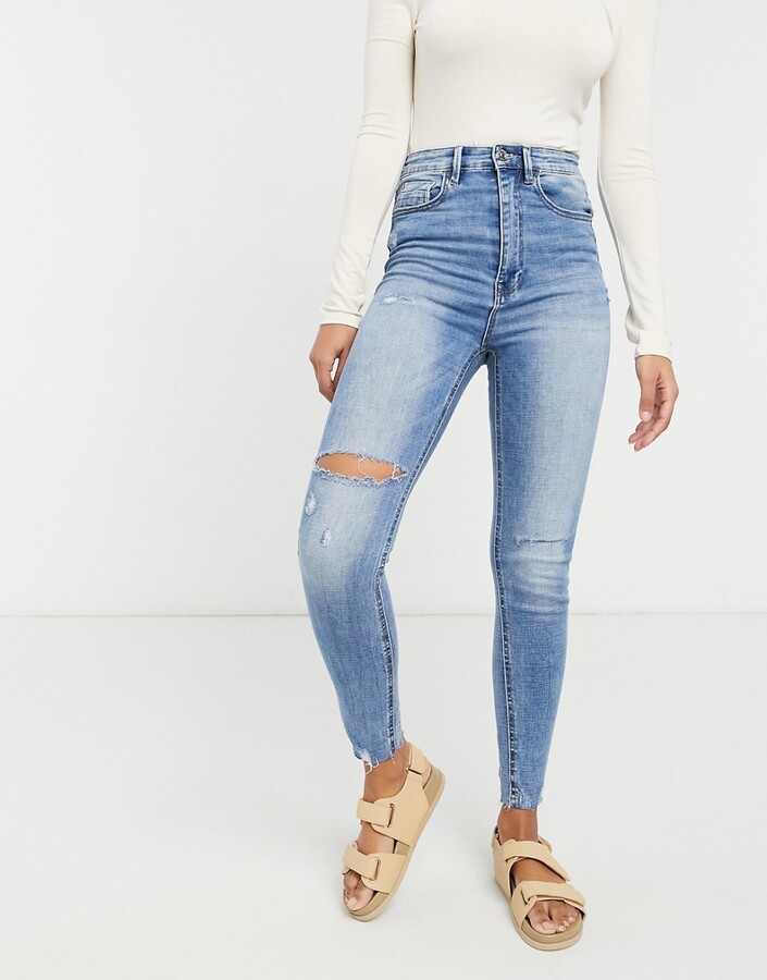 Stradivarius super high waist skinny jean with rip in light blue - ShopStyle