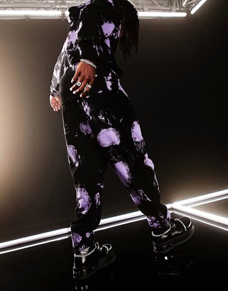 ASOS DESIGN set oversized sweatpants in black and purple tie dye with text  print - ShopStyle Pants