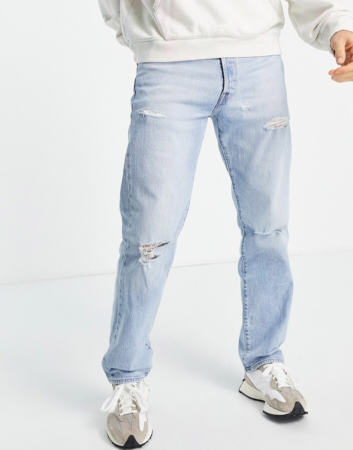 Levi's 501 straight fit jeans in light blue wash with rips - ShopStyle