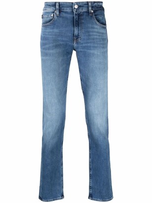 Calvin Klein Jeans Infinite Flex slim-leg jeans - ShopStyle