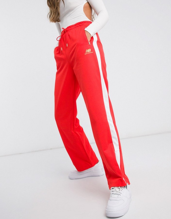 New Balance wide leg sweatpants in red - ShopStyle Activewear Pants