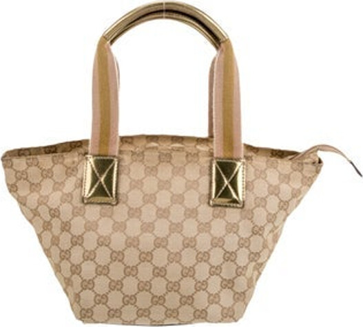 Gucci Top Handle Bag Neutrals Canvas GG Canvas Gold-Tone Hardware Leather Trim Rolled Handles Leather Trim Embellishment Canvas Lining & Single Interior Pocket Zip Closure at Top Includes Dust Bag