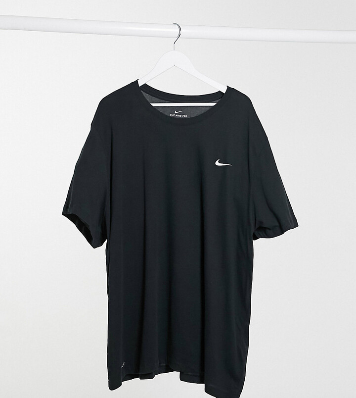 nike shirt with swoosh in middle