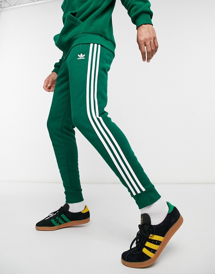 adidas adicolor three stripe pants in green - ShopStyle Chinos & Khakis