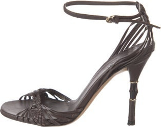 Gucci Leather Sandals Brown Bamboo Accent Braided Accents Wrap-Around Straps & Buckle Closure at Ankles Unfortunately, due to restrictions, this item may not be eligible for shipping in all areas.