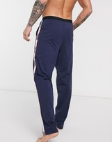 Thumbnail for your product : ASOS DESIGN lounge pyjama bottoms in navy with branded side panels
