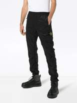 Thumbnail for your product : Stone Island logo embellished trousers