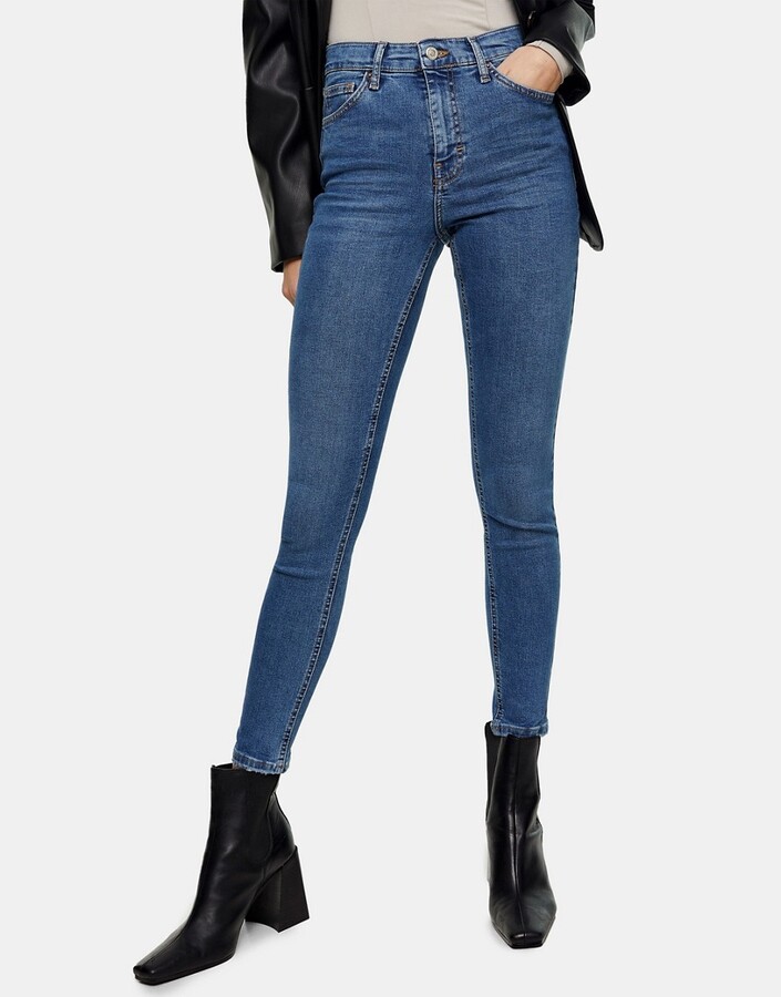 Topshop Jamie abraded hem jeans in mid blue - ShopStyle