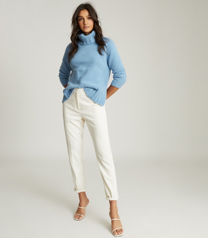 pale blue polo neck jumper