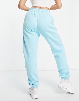 Nike mini swoosh oversized joggers in copa blue - ShopStyle Plus Size  Trousers